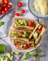 Healthy toast with vegetables, pesto and cheese