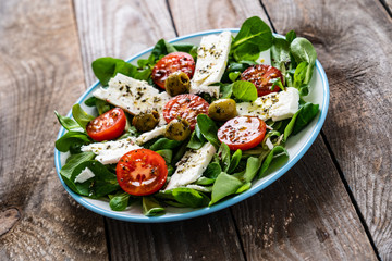 Greek salad on wooden background