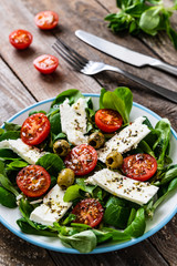 Greek salad on wooden background