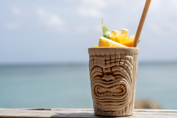 Summer tropical cocktails in a creative cup