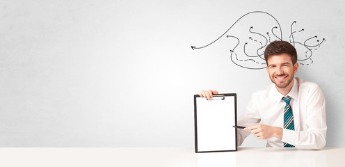 Handsome man teaching abc in classroom