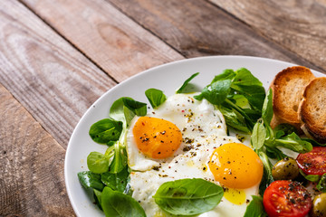 Breakfast - fried egg ,toasts and vegetabla salad