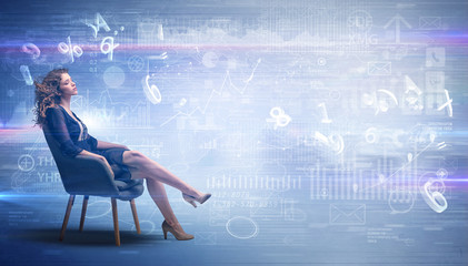 Elegant woman sitting in a sofa with numbers and reports concept