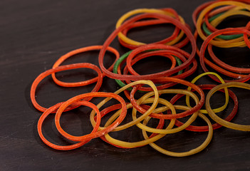 Many rubber bands stacked together