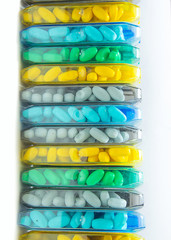 Abstract background, various flavored candies in colorful packaging