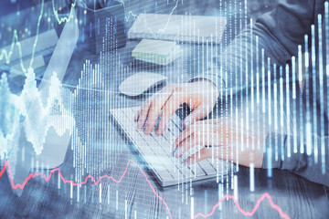 Double exposure of financial graph with man works in office on background. Concept of analysis.