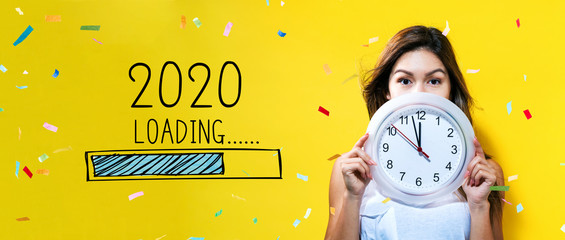 Loading new year 2020 with young woman holding a clock showing nearly 12