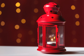 Red lantern on a shiny light dark red background