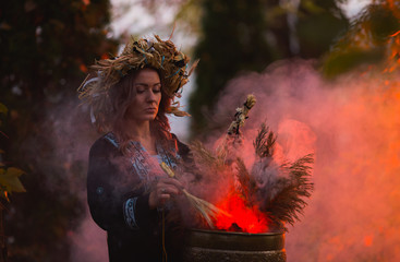 Woman sitting in burning pentagram circle, magic.