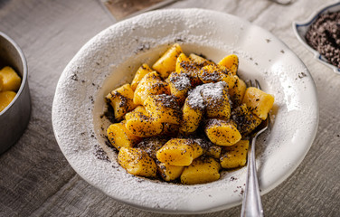 Pumpkin dumplings with poppy seeds and butter