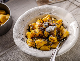 Pumpkin dumplings with poppy seeds and butter