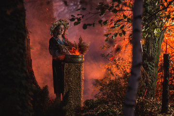 Woman sitting in burning pentagram circle, magic.
