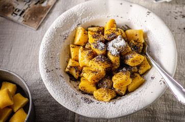 Pumpkin dumplings with poppy seeds and butter