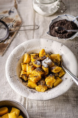 Pumpkin dumplings with poppy seeds and butter