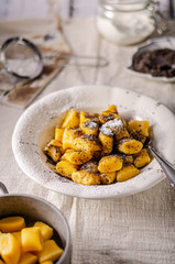 Pumpkin dumplings with poppy seeds and butter
