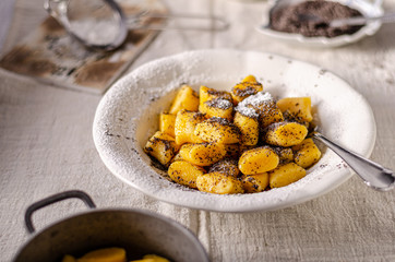 Pumpkin dumplings with poppy seeds and butter