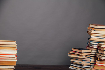 a lot of different educational books on a gray background