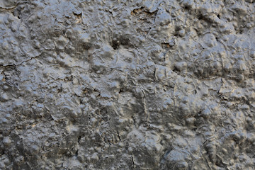 Black textured surface of volcanic lava as an element of design and decoration