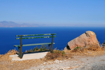 empty bench in front of the sea, Nisyros, Greece