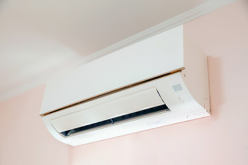 Wall mounted air conditioner in livingroom after cleaning and maintenance.