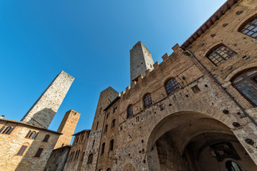 Fototapeta na wymiar San Gimignano Siena Tuscany Old palace of the podesta rognosa tower and Chigi tower