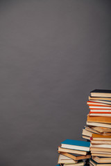 a lot of different educational books on a gray background