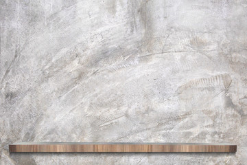 Raw cement or concrete wall with empty wooden shelves in loft Style for background.