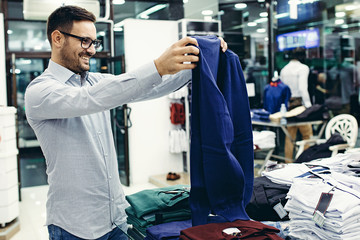 Smiling Young Man Enjoying Shopping