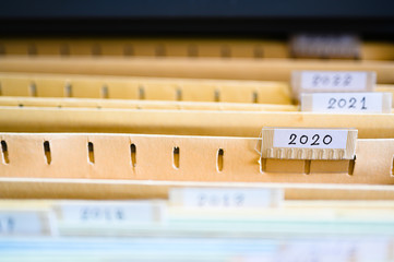 Year 2020 documents placed in a file cabinet at the office.