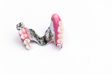 clasp prosthesis on the upper jaw. upper denture. false teeth. ceramic teeth. removable denture. White background