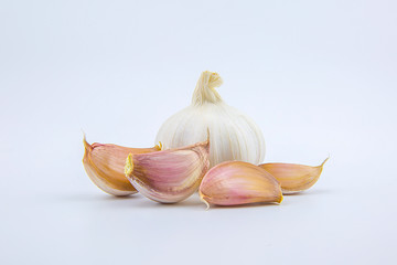 Head and cloves garlic isolated on a white background.