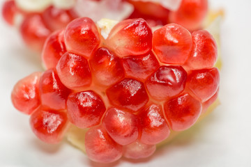 pomegranate cut seed red ripe isolated pieces