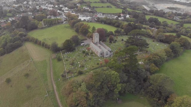 Hilltop church in town of Newton Abbot, Devon - Aerial drone footage