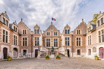 Ancient renaissance building Hotel Groslot with statue of Jeanne D arc, in use as town hall in Orleans France