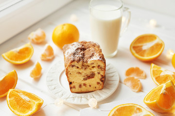 Christmas cupcake with oranges on a white background