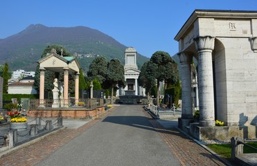Fototapeta na wymiar Lugano (Switzerland). April 2017 Cemetery architecture. Some graves date from 1800 and earlier.