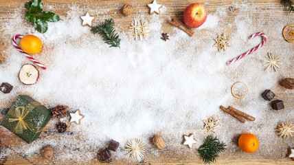 snow on wooden table with christmas decoration, winter