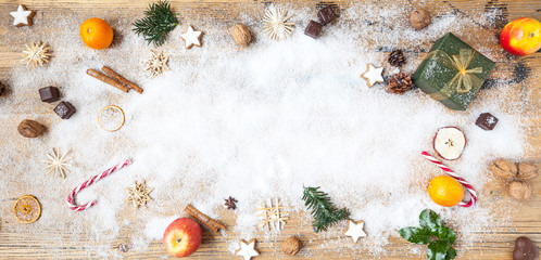 snow on wooden table with christmas decoration, winter