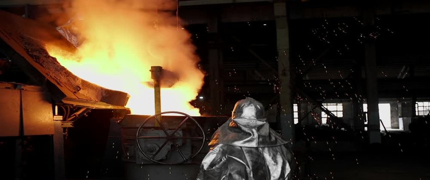 Liquid metal in the foundry, melting iron in furnace, steel mill