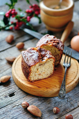 Obraz na płótnie Canvas Almond sponge cake with rustic background