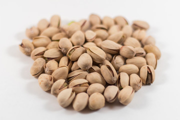Pile of Organic Pistachios Center of White Background
