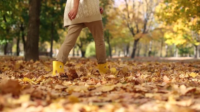 many autumn leaves fall girl yellow boots