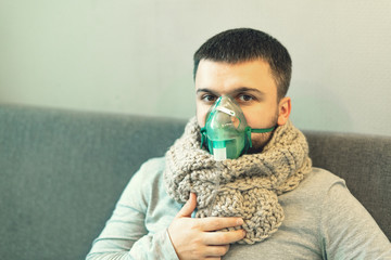 Alternative treatments. Home treatment. The disease and its treatment. A man in a warm scarf and a...