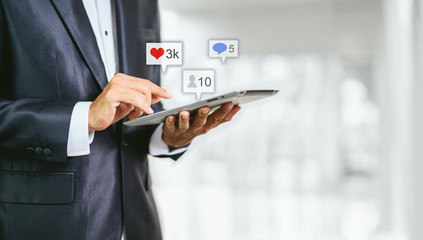 Hand using smartphone with Social media concept