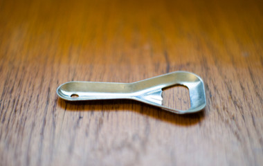 bottle opener on wooden table