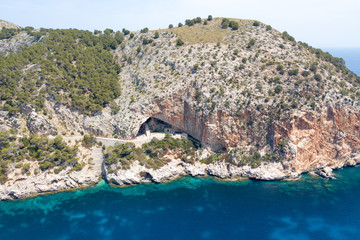 Rock with the entrance to the cave of Arta on the island of Mallorca