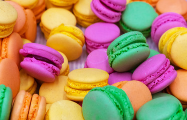 Fototapeta na wymiar Display case with a colorful variety of Parisian macaron cookies.
