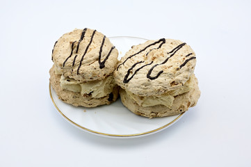 Photo on a white background of a cake on a saucer. The concept of a delicious breakfast, lunch.
