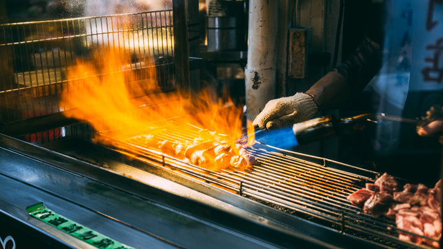 Employees are grilling meat to be sold, Taipei, Taiwan - 11 jun 2562.