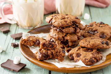 Baked Christmas cookies. Homemade Chocolate Chip Cookies on a light stone table.